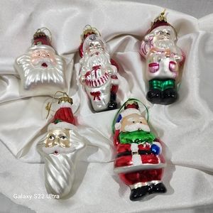 Set of 5 small glass Santa's.  Average is 3 inches.